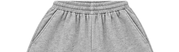 Detalle de la pretina elástica y los bolsillos del jort melange